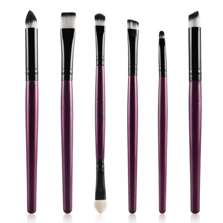Set of 6 eye makeup brushes with metallic purple handles, black ferrules, and dual-toned white and black synthetic hair.