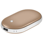 A gold and white oval portable hand warmer with a power button, USB port, and charging indicator lights.