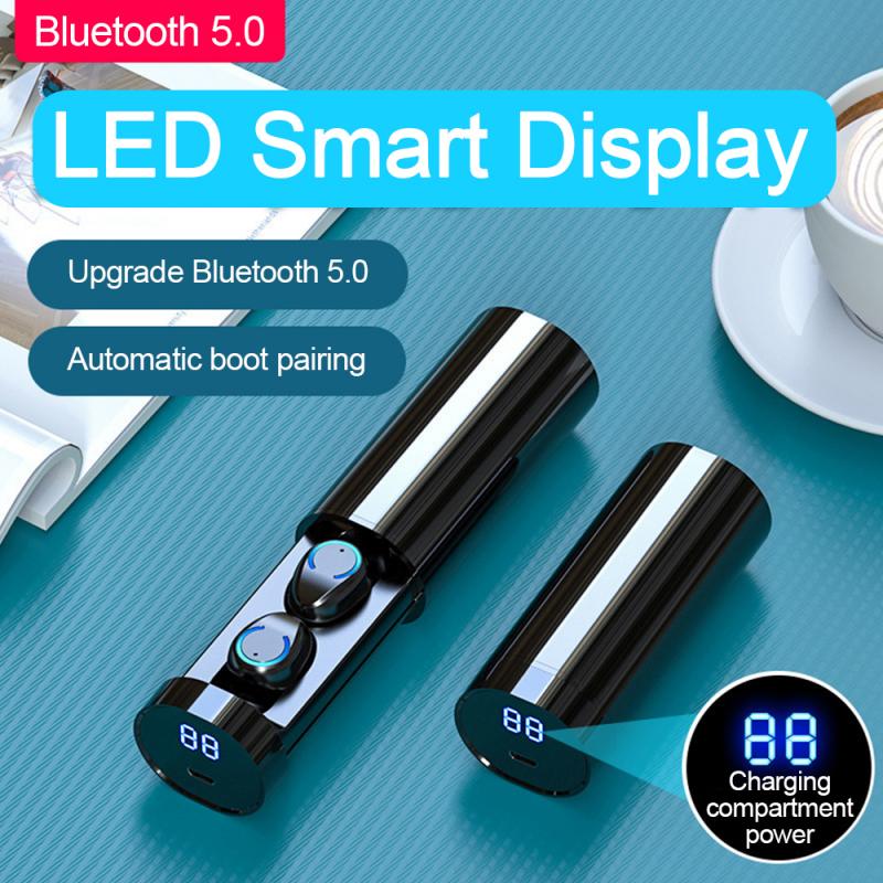 Black cylindrical charging case with two wireless earbuds and a digital LED power display.