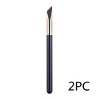 An angled eyebrow makeup brush with a black handle, gold ferrule, and synthetic bristles. Set of 2 pieces.