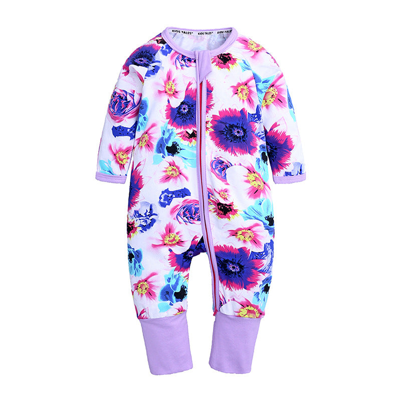 Baby cotton sleeper with floral print in pink, purple, and blue, featuring a front zipper and lavender ribbed cuffs.
