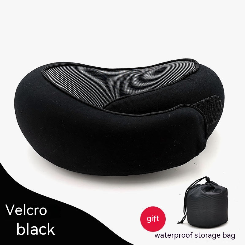 Black, ergonomic cervical neck pillow with mesh fabric and a velcro strap, shown with a matching storage bag.