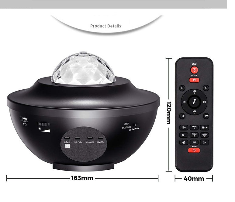 Black UFO-shaped LED projector lamp with crystal dome, USB ports, power switch, and a matching remote control.