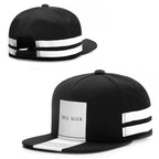 Black hip-hop snapback hat featuring two white horizontal stripes and a central white panel labeled "TRES SLICK."