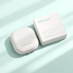 Lakerain Neo Blurring Powder in a white square compact and matching box on a soft mint green background.