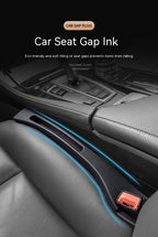 Black car seat gap filler made of soft, durable material inserted between the seat and center console to prevent drops.