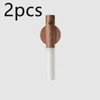Two magnetic wooden wall lights with a white frosted LED section and a built-in PIR motion sensor.