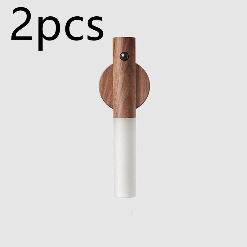 Two magnetic wooden wall lights with a white frosted LED section and a built-in PIR motion sensor.