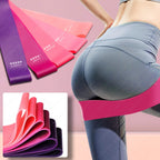 A set of 5 colorful, rubber resistance bands for fitness, labeled by intensity from x-light to x-heavy.