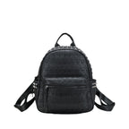 Black soft leather backpack with an embossed skull pattern, metal rivet stud accents, and a front zip pocket.