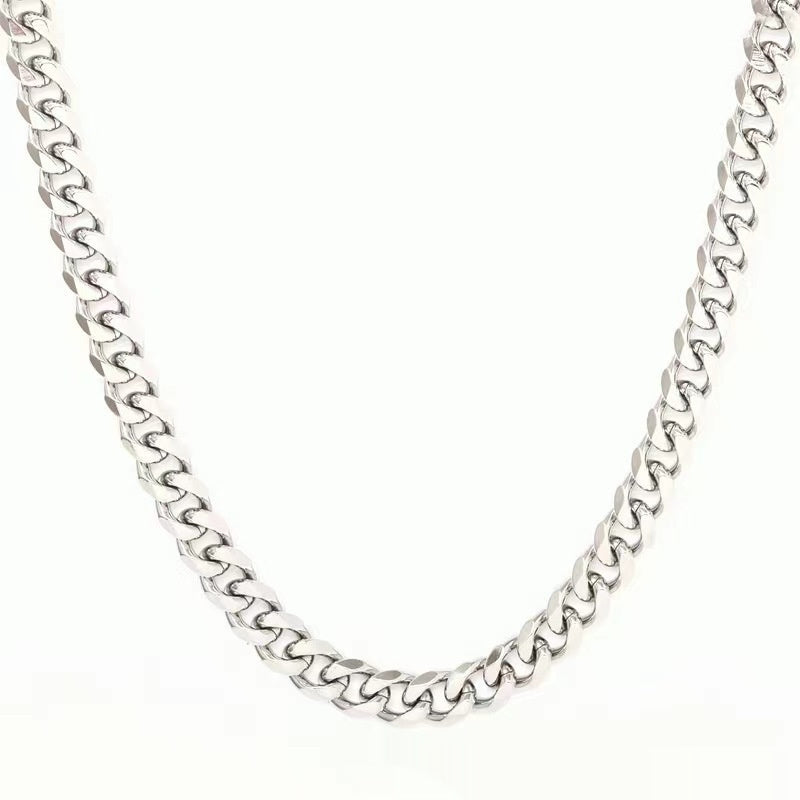 Silver-tone Cuban link chain necklace with polished, interlocking metal links in a classic hip-hop style.