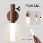 Magnetic wood LED night light with motion sensor. Minimalist wall-mounted design with detachable, rechargeable light.