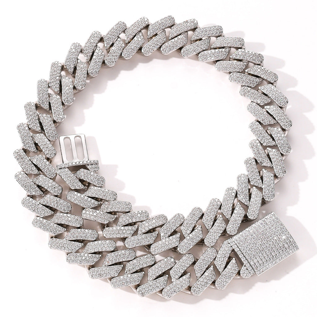 Iced-out silver Cuban link chain necklace fully paved with sparkling white cubic zirconia stones.