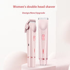 Two light pink, double-headed electric hair trimmers with rose gold accents and metal blades on a matching stand.