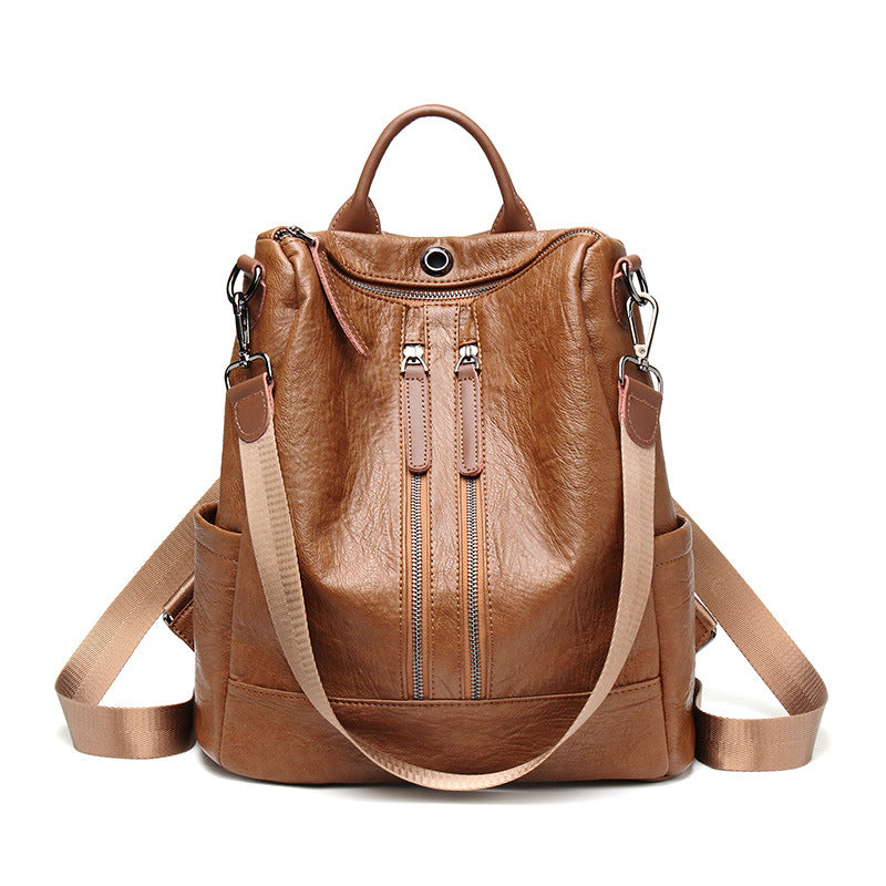 Brown soft leather multifunctional backpack by Digitaldistribution375 with vertical zip pockets and webbing straps.