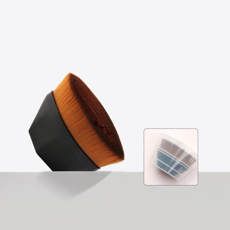 Oval foundation makeup brush with a black handle and soft brown bristles, including a clear protective storage case.