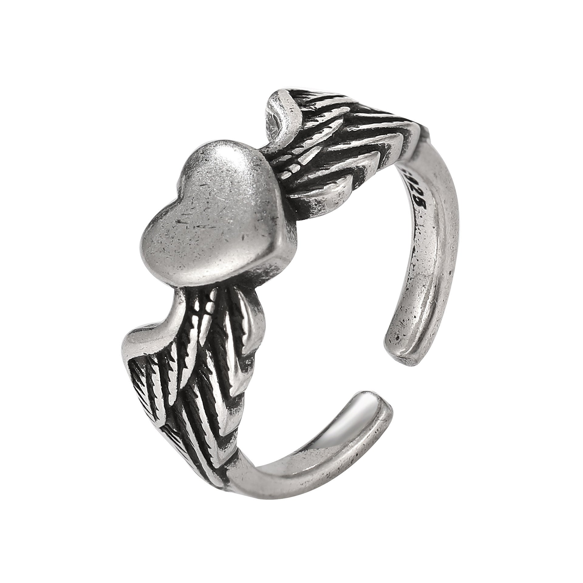 Antique silver-tone ring featuring a central heart accented by detailed angel wings on an open-band style.