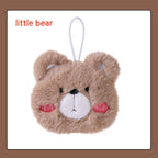 A fluffy, tan plush bear-shaped hand warmer with a white muzzle, pink rosy cheeks, and a white hanging loop.
