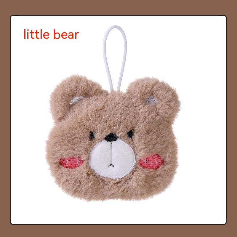 A fluffy, tan plush bear-shaped hand warmer with a white muzzle, pink rosy cheeks, and a white hanging loop.