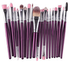 Set of 20 makeup brushes with purple metallic handles, silver ferrules, and soft pink and brown synthetic bristles.