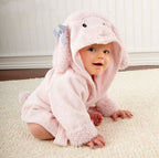 Baby wearing a soft, pink hooded cotton bathrobe with poodle ears and a striped bow.