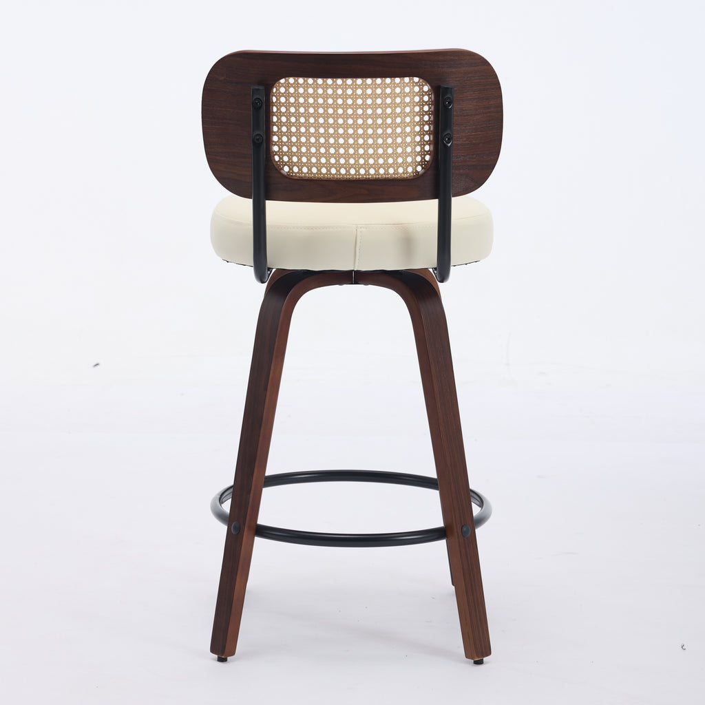 Walnut-finish 26-inch swivel bar stool with a cane backrest, cream upholstered seat, and black metal footrest ring.