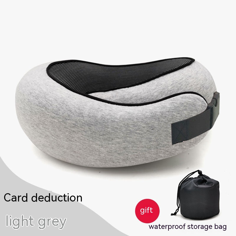 Light grey, curved cervical travel pillow with black mesh lining, adjustable buckle strap, and a waterproof storage bag.