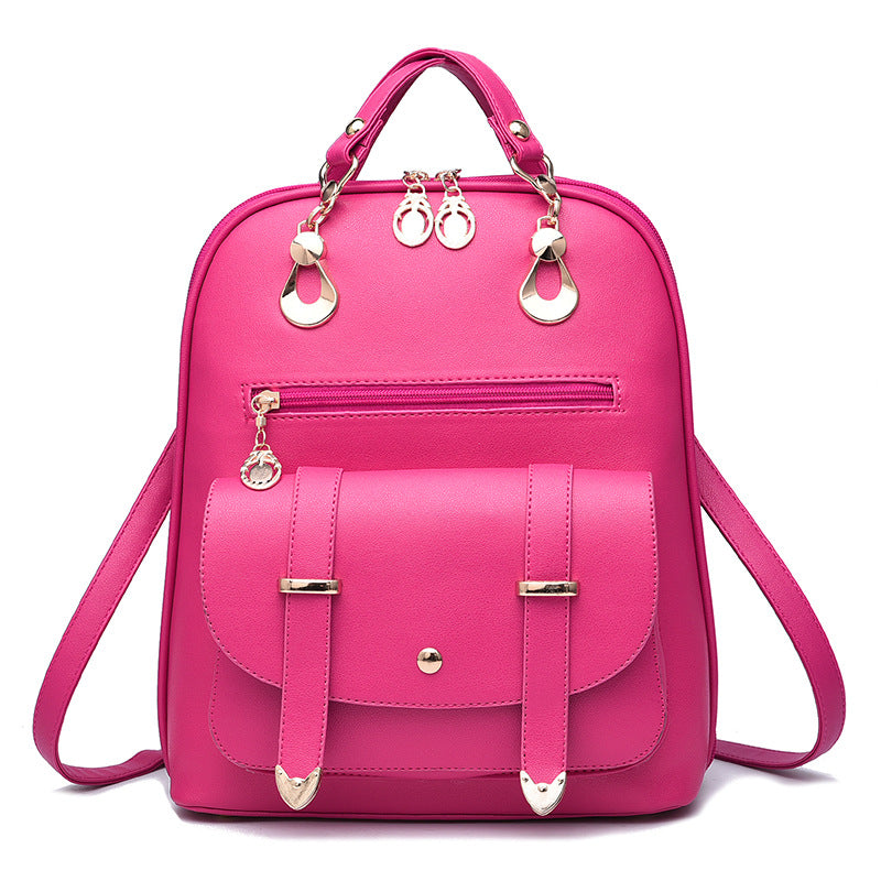 Hot pink PU leather dual-use backpack with gold-tone hardware, top handle, zippered pockets, and front flap closure.