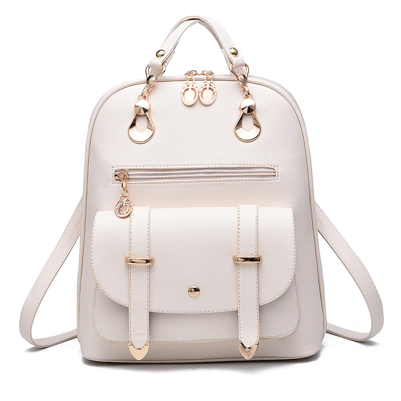 Off-white PU leather convertible backpack with gold-tone hardware, front pocket with buckle straps, and top handle.