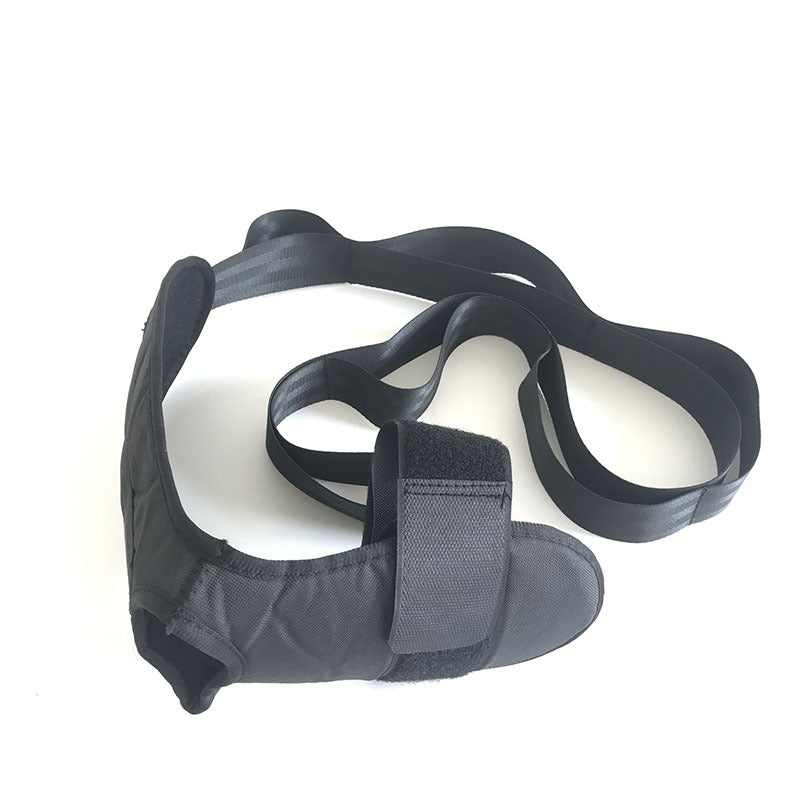 Black adjustable fabric foot and ankle rehabilitation strap with velcro closures and long tension bands.