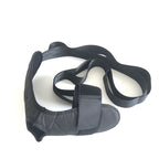 Black adjustable fabric foot and ankle rehabilitation strap with velcro closures and long tension bands.