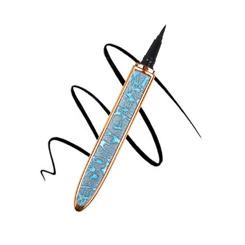 Digitaldistribution375 self-adhesive liquid eyeliner pen in a glittery blue and gold casing with a black ink swirl.