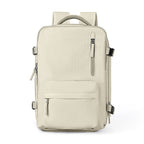 Beige waterproof travel backpack with multiple zippered pockets, adjustable side buckles, and comfortable mesh handle.