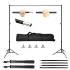 Black adjustable backdrop stand set with two tripods, crossbars, carrying bag, and four clips on a white background.