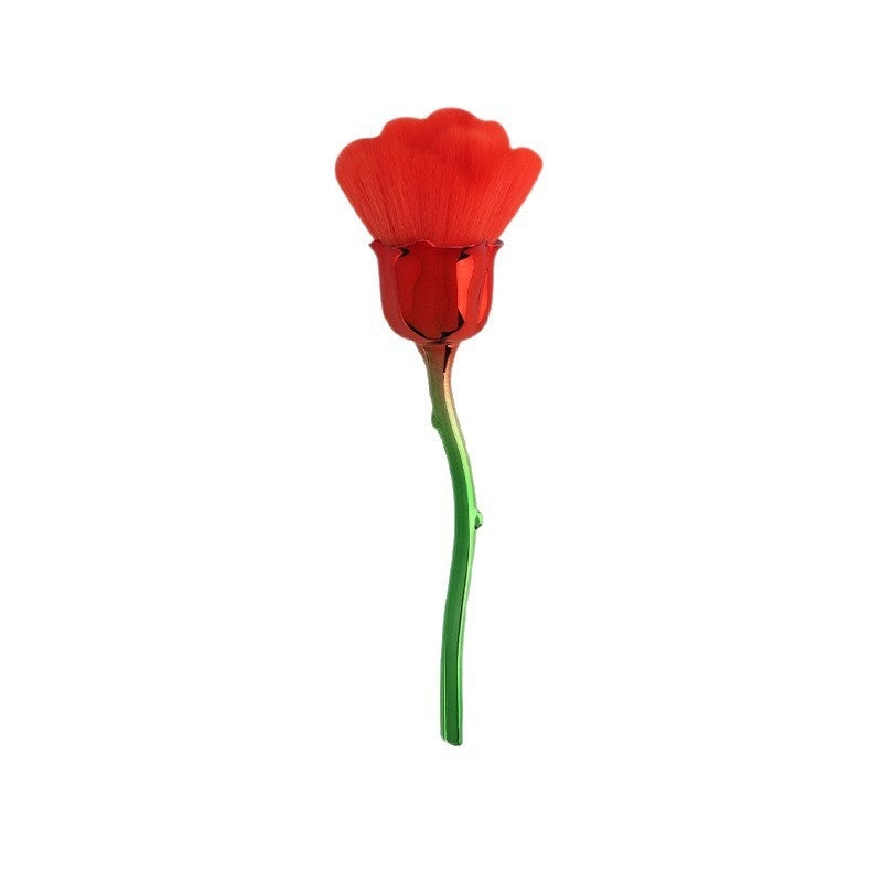 A red rose-shaped makeup brush for loose powder, featuring soft bristles, a metallic red cup, and a green metal stem.
