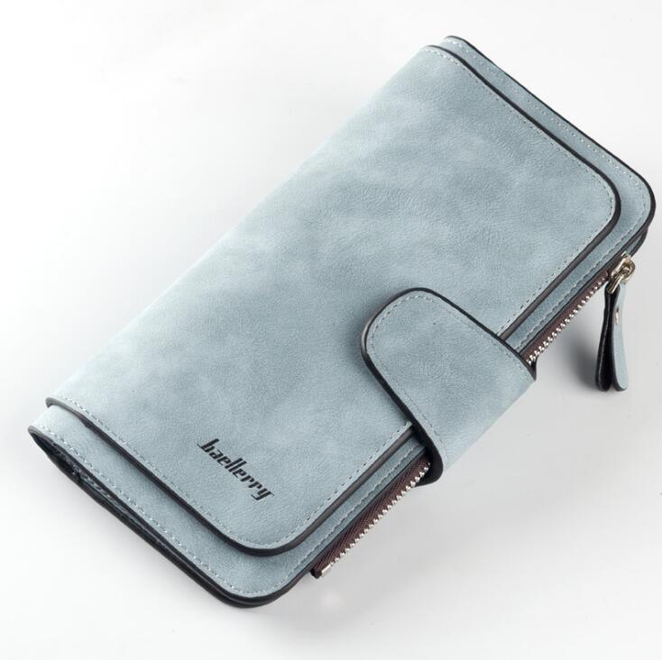 Light blue, faux-suede Baellerry women’s wallet with a zippered coin pocket, snap closure, and dark trim.