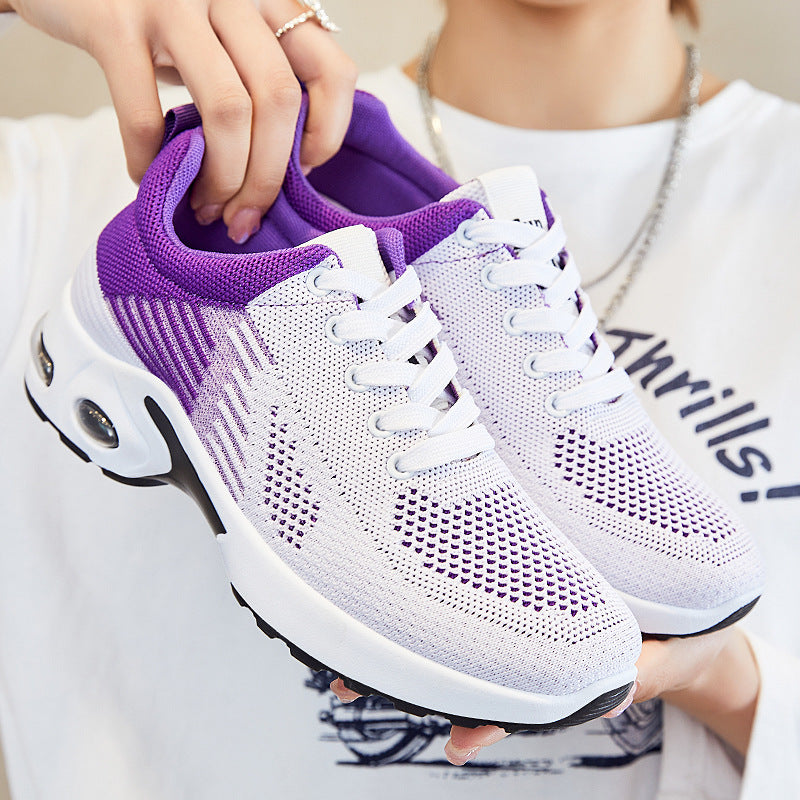 White and purple mesh women’s sneakers with white laces, breathable knit fabric, and a cushioned air-bubble sole.