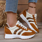 Women's casual sneakers with brown suede, cream knit, leopard print stripes, white thick soles, and white laces.