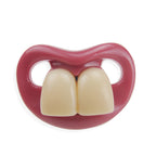 Funny Digitaldistribution375 pacifier with a pink plastic base and oversized, off-white toy front teeth.