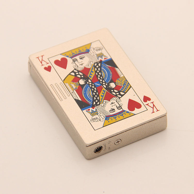 Metallic silver rectangular windproof lighter featuring a King of Hearts playing card design on a textured surface.