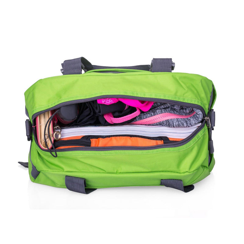 Open bright green fabric yoga bag with grey straps, filled with athletic gear, a notebook, and a wallet.