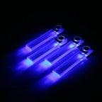 Four rectangular, translucent acrylic LED car atmosphere lights emitting a bright blue glow against a black background.