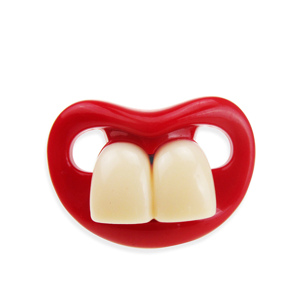 Funny baby pacifier with bright red lips and two large, prominent white front teeth made of smooth plastic.