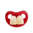 Funny baby pacifier with bright red lips and two large, prominent white front teeth made of smooth plastic.
