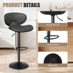 Black bar stool with grey faux leather seat, gas lift, circular footrest, and stable matte black pedestal base.