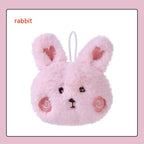 Pink plush rabbit hand warmer with heart-detailed ears, embroidered face, rosy cheeks, and a white hanging loop.