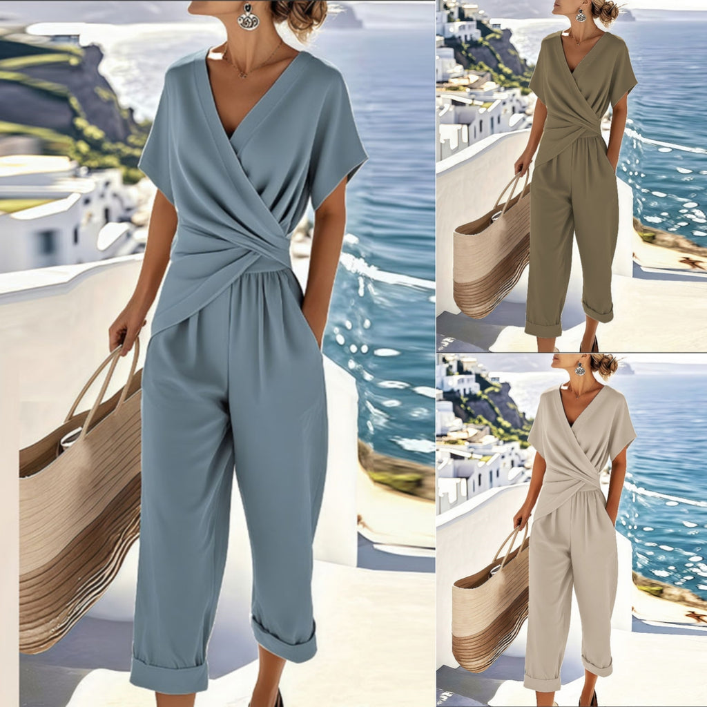 Women's solid color two-piece sets featuring a V-neck wrap top with short sleeves and matching cropped trousers.