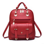 Red PU leather dual-use fashion backpack with gold hardware, top handle, and a front buckle-flap pocket.