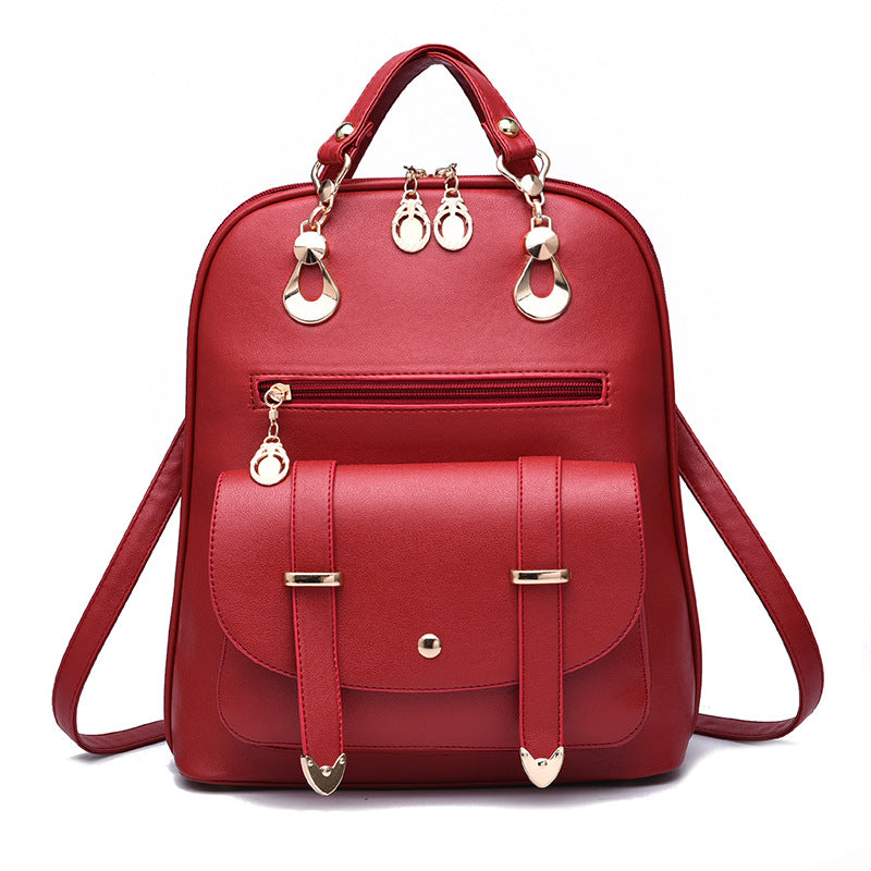 Red PU leather dual-use fashion backpack with gold hardware, top handle, and a front buckle-flap pocket.