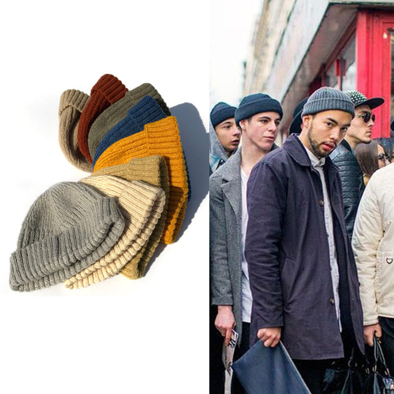Stack of multi-colored retro ribbed knit beanies and a photo of men wearing them in an urban hip hop style.